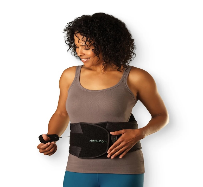 Patient adjusting the Aspen Horizon LSO back brace